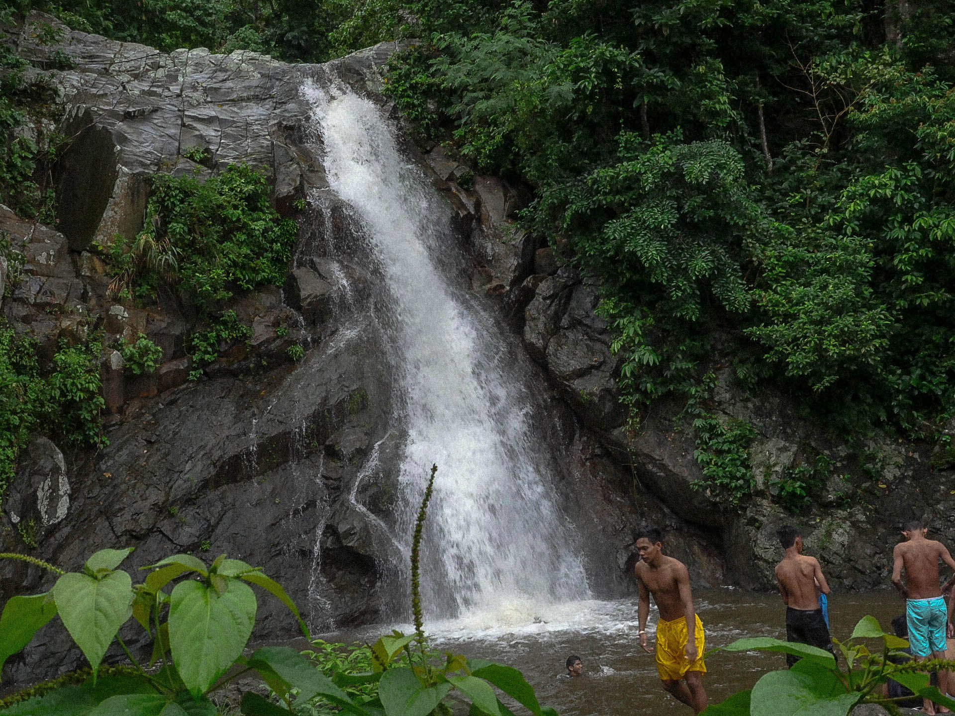 filipino youth playing at at maribina falls in bato catanduanes philippines